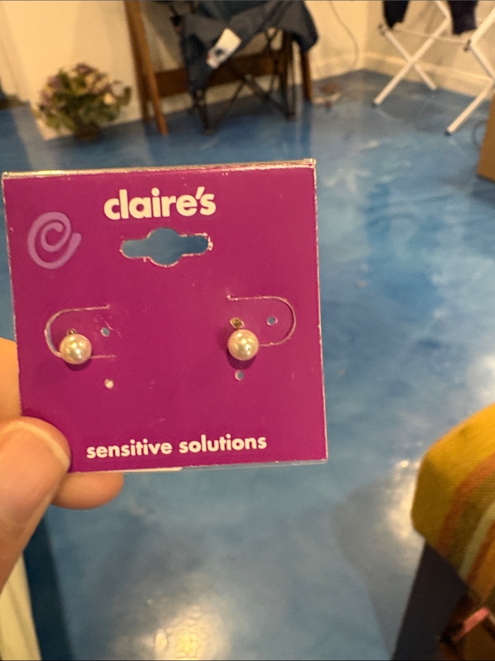 Claire's White Faux Pearl Stud Earrings on Purple Card
